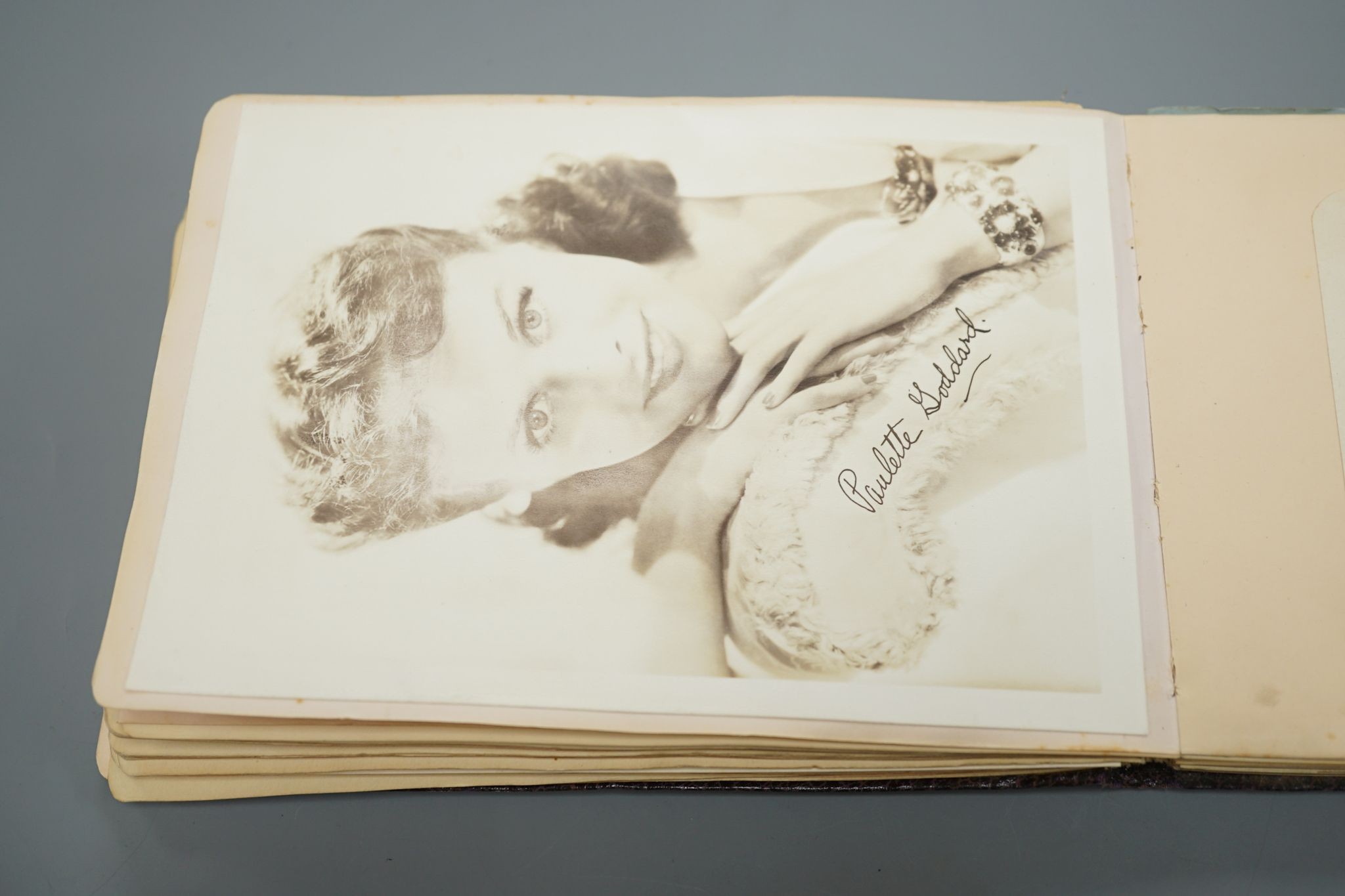 A 1930-40's autograph album including Judy Garland, Spencer Tracy, Basil Rathbone etc. and a photo album